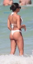 SplashNews American model Jordan Ozuna wears a white thong bikini at the beach in Miami Beach, FL. Tyga was seen courting Jordan in April on a date in Beverly Hills.