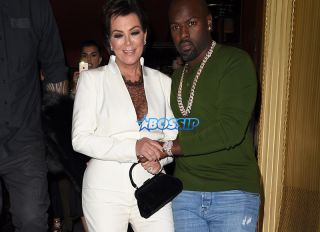 Kris Jenner looks worst for wear as she is helped to her waiting car by Corey Gamble after a 4 hour bender at the Costes Restuarnt in Paris.