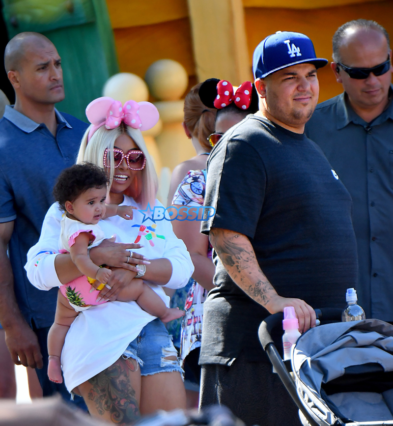 Rob Kardashian celebrates Father's day with Blac Chyna and their daughter Dream at the Happiest Place on earth. Rob and Chyna were happy to show their 7 months old different parts of the park including the small world ride and the Alice in Wonderland ride. They enjoyed snacks including a bag of sweets and an slurpee from ToonTown.