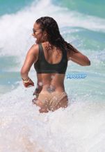 Singer Christina Milian in a bikini at the beach of the Eden Roc hotel in Miami Beach SplashNews