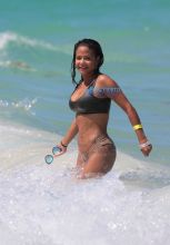 Singer Christina Milian in a bikini at the beach of the Eden Roc hotel in Miami Beach SplashNews