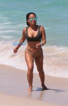 Singer Christina Milian in a bikini at the beach of the Eden Roc hotel in Miami Beach SplashNews