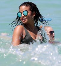 Singer Christina Milian in a bikini at the beach of the Eden Roc hotel in Miami Beach SplashNews