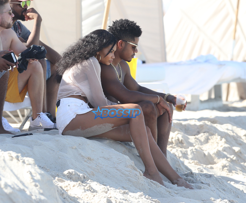 Supermodel Chanel Iman and boyfriend Sterling Shepard get romantic on the beach in Miami Beach, FL.