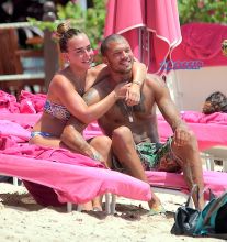 Hot Felon Jeremy Meeks t on the beach with his girlfriend, Topshop Heiress, Chloe Green. The couple packed on the PDA as they sat near the ocean in Barbados. jet ski, shower