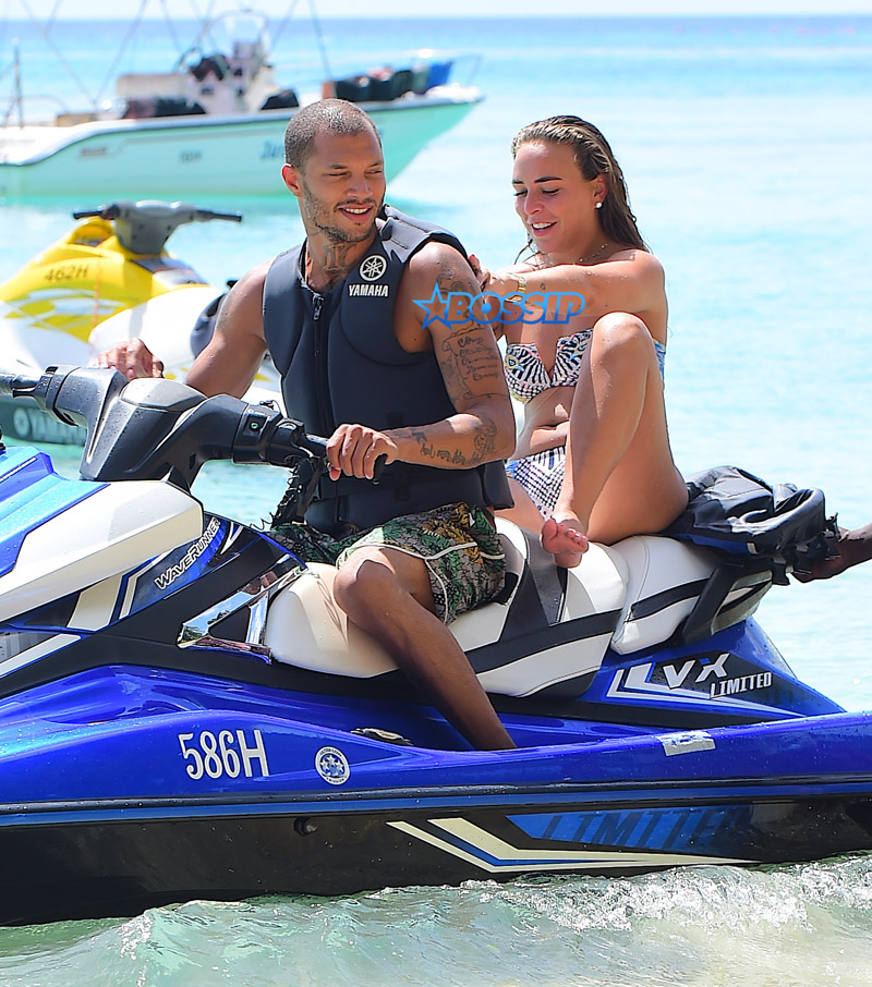 Topshop Heiress Chloe Green and her new boyfriend, "Hot Felon" Jeremy Meeks were spotted enjoying their holiday in Barbados on Saturday. The loved up couple took a wild ride on a Jetski in the light blue Caribbean waters . Afterwards they washed off in the shower together . Meeks showed off his tattoos as he wore a Gucci swimsuit z