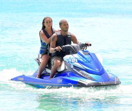 Topshop Heiress Chloe Green and her new boyfriend, "Hot Felon" Jeremy Meeks were spotted enjoying their holiday in Barbados on Saturday. The loved up couple took a wild ride on a Jetski in the light blue Caribbean waters . Afterwards they washed off in the shower together . Meeks showed off his tattoos as he wore a Gucci swimsuit