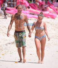 Hot Felon Jeremy Meeks t on the beach with his girlfriend, Topshop Heiress, Chloe Green. The couple packed on the PDA as they sat near the ocean in Barbados. jet ski, shower