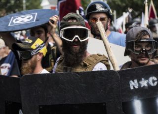 Alt-right rally members crash with counter protesters in Lee Park in Charlottesville. Alt-right group and white supremest members gathered and formed a big rally in Lee Park.