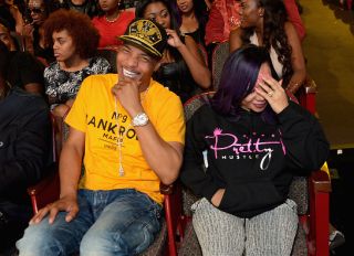 ATLANTA, GA - OCTOBER 09: T.I. (L) and Tameka "Tiny" Cottle-Harris enjoy the BET Hip Hop Awards Show 2015 at the Atlanta Civic Center on October 9, 2015 in Atlanta, Georgia.