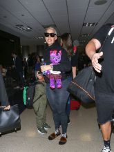 Amber Rose and her son Sebastian are seen at Los Angeles International Airport in Los Angeles, California.