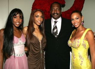 NEW YORK - JUNE 23: (EXCLUSIVE) (L-R) Singers Kelly Rowland, Michelle Williams and Beyonce Knowles pose with their manager Matthew Knowles at the "Beyonce: Beyond the Red Carpet auction presented by Beyonce and her mother Tina Knowles along with the House of Dereon to benefit the VH1 Save The Music Foundation June 23, 2005 in New York City.