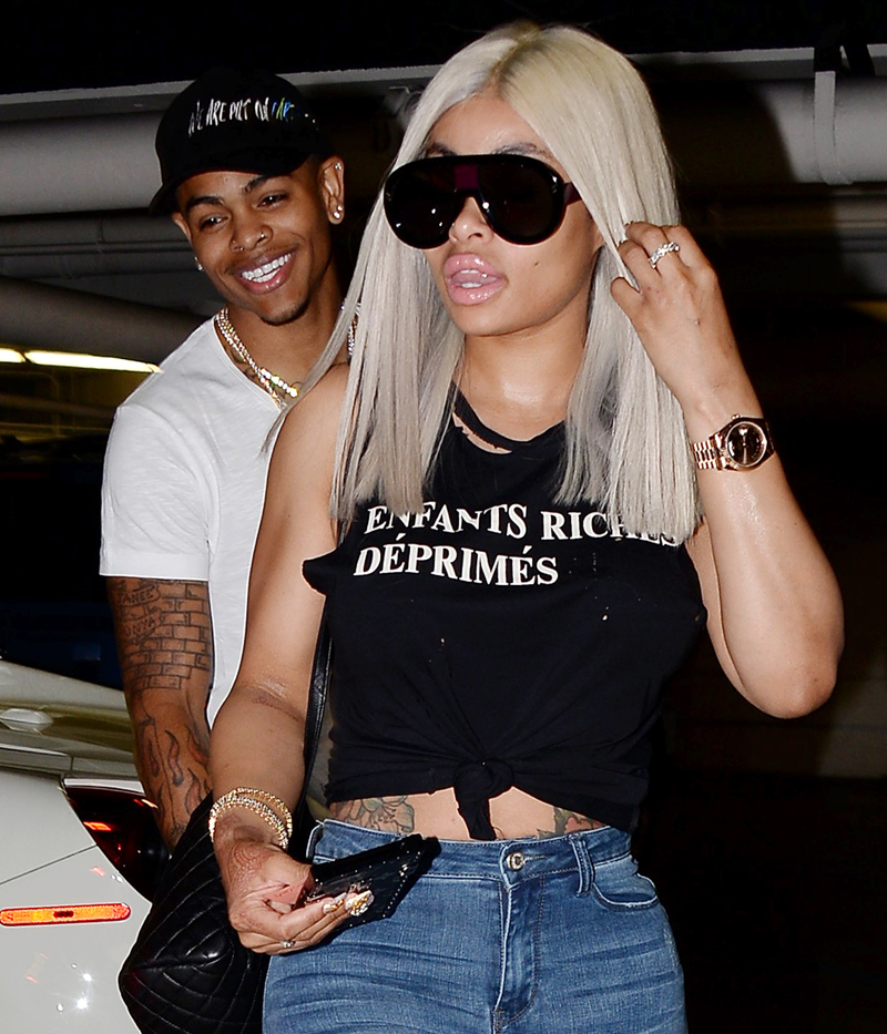 Blac Chyna gives a peek at taut tummy in knotted and distressed top while out with beau Mechie in Los Angeles