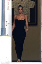 Kim Kardashian arrives in a coat and changes inside the private airport lounge upon landing to attend Serena Williams A list wedding. Kim was wearing a sleek cocktail dress as she arrived with Malika and Kadishah, Khloe's close twin friends. Kim was heading straight to the venue via the private airport. Kim did her best catwalk down the jetway heading to the car.