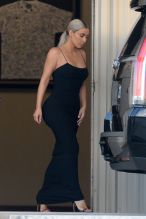 Kim Kardashian arrives in a coat and changes inside the private airport lounge upon landing to attend Serena Williams A list wedding. Kim was wearing a sleek cocktail dress as she arrived with Malika and Kadishah, Khloe's close twin friends. Kim was heading straight to the venue via the private airport. Kim did her best catwalk down the jetway heading to the car.