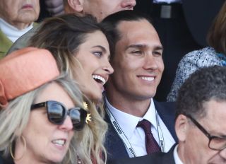 Paris Jackson is seen flirting with an unknown man at the Melbourne Cup.