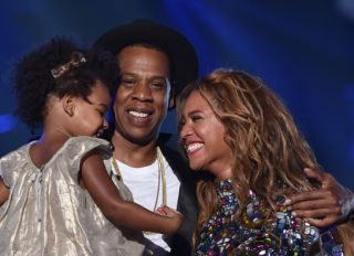 INGLEWOOD, CA - AUGUST 24: (L-R) Blue Ivy Carter, recording artists Jay-Z and Beyonce speak onstage during the 2014 MTV Video Music Awards at The Forum on August 24, 2014 in Inglewood, California.