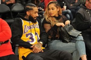 LOS ANGELES, CA - DECEMBER 25: Rapper Nipsey Hussle and Lauren London attend a basketball game between the Los Angeles Lakers and the Minnesota Timberwolves at Staples Center on December 25, 2017 in Los Angeles, California.
