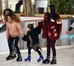 Kourtney Kardashian and boyfriend Younes Bendjima ice skating with Penelope and North at a christmas party in Thousand Oaks