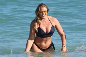 English model Iskra Arabella Lawrence in a bikini swimming in Miami Beach
