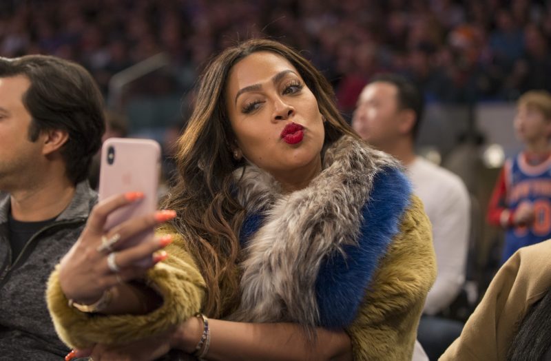 Lala Anthony sits court side at Madison Square Garden as her husband, Oklahoma City Thunder forward Carmelo Anthony #7 plays his former team, the NY Knicks.