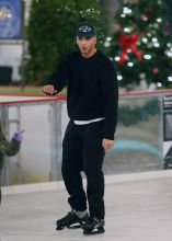 Kourtney Kardashian and boyfriend Younes Bendjima ice skating with Penelope and North at a christmas party in Thousand Oaks