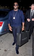 P. Diddy was seen with a Maxfield Present in hand arriving at Mary J Blige private low key birthday party at Mr. Chow Restaurant in Beverly Hills, CA