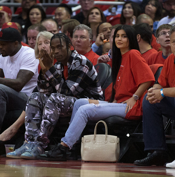 HOUSTON, TX - APRIL 25:  Houston rapper Travis Scott and Kylie Jenner watch courtside during Game Five of the Western Conference Quarterfinals game of the 2017 NBA Playoffs at Toyota Center on April 25, 2017 in Houston, Texas 