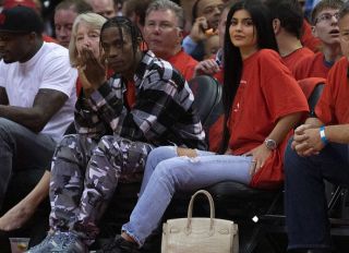 HOUSTON, TX - APRIL 25: Houston rapper Travis Scott and Kylie Jenner watch courtside during Game Five of the Western Conference Quarterfinals game of the 2017 NBA Playoffs at Toyota Center on April 25, 2017 in Houston, Texas
