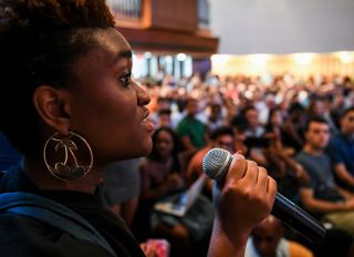 WASHINGTON, DC - SEPTEMBER 27: Ofonime Idiong speaks during a forum about racist posters that were discovered on campus at the Kay Spiritual Life Center at American University on September 27, 2017 in Washington, DC.