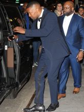 Jamie Foxx poses with Officers while leaving Clive Davis party in New york