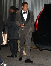 Jay-Z leaves Clive Davis party in New york with champagne glass