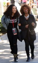 Alfre Woodard and Jurnee Smollett walk arm in arm as they attend the 2018 Womens March in downtown Los Angeles, Ca Alfre was also spotted wearing a necklace made of photographs of Nelson Mandela