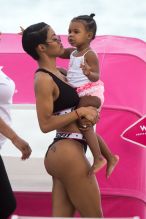 Teyana Taylor is seen with her daughter Iman Tayla Shumpert Jr. on the beach in Miami