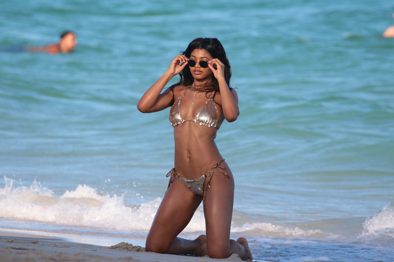 SI Swimsuit model Danielle Herrington shows off her curves in a metallic two piece bikini in Miami Beach, FL.