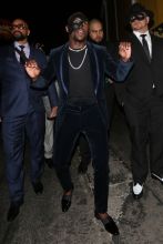 Professional boxer Floyd Mayweather wears a face mask as he arrives to Serafina Sunset restaurant to celebrate his 41st birthday party with family and friends in West Hollywood