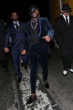Professional boxer Floyd Mayweather wears a face mask as he arrives to Serafina Sunset restaurant to celebrate his 41st birthday party with family and friends in West Hollywood