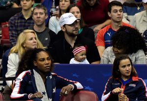 ASHEVILLE, NC - FEBRUARY 10: Serena Williams of Team USA, bottom left, along with her husband Alexis Ohanian and their daughter Alexis Olympia, center, watch the action during the first round of the 2018 Fed Cup at US Cellular Center on February 10, 2018 in Asheville, North Carolina.