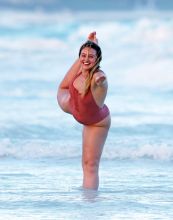 Iskra Lawrence in a one piece bathing suit while the beach in Tulum Mexico.