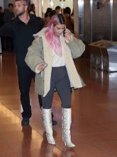 Kim Kardashian is all smiles as she poses with fans upon landing in Tokyo with her sisters for their first family trip overseas together in 2018. Kim was very happy to take some photos with her loyal fans as she flashed a peace sign and was spotted in customs with Kourtney and Khloe as they had their entourage and luggage with them. The girls made their way through the airport as a group and headed out of the airport for their first night in the city.