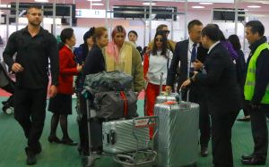 Kim Kardashian is all smiles as she poses with fans upon landing in Tokyo with her sisters for their first family trip overseas together in 2018. Kim was very happy to take some photos with her loyal fans as she flashed a peace sign and was spotted in customs with Kourtney and Khloe as they had their entourage and luggage with them. The girls made their way through the airport as a group and headed out of the airport for their first night in the city.