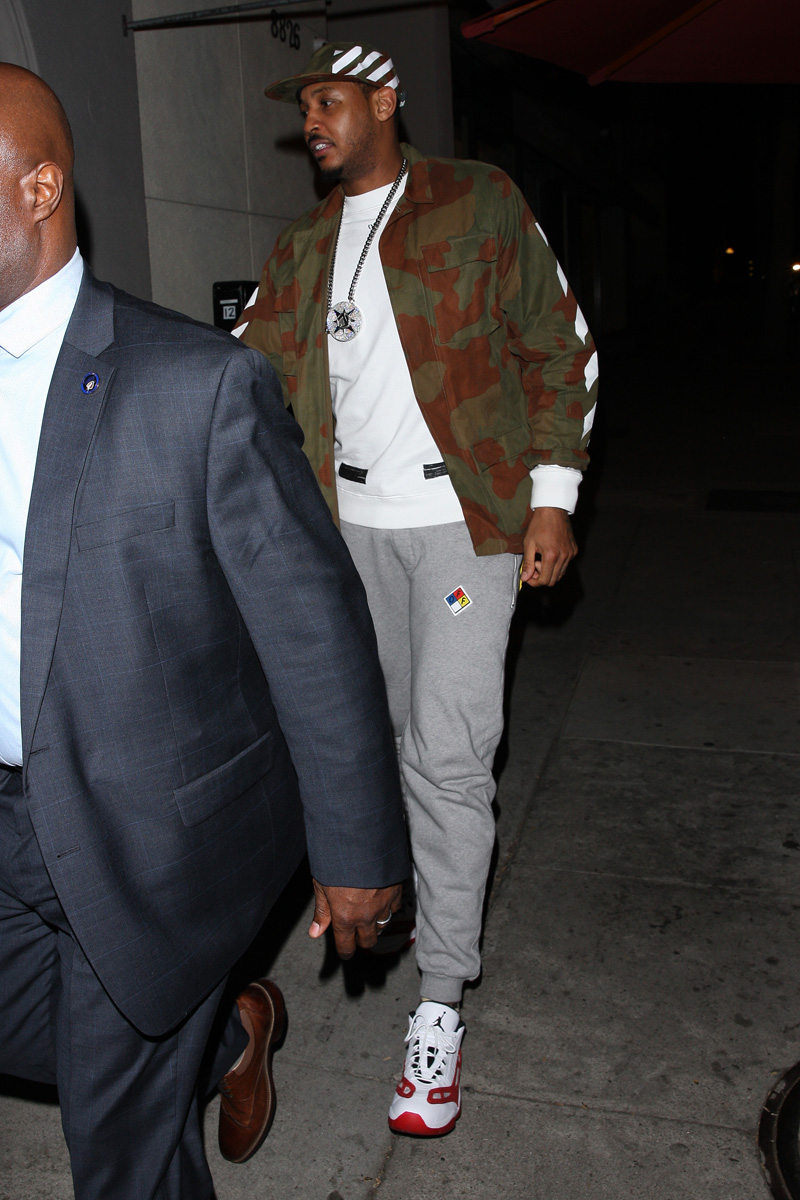 Professional basketball player Carmelo Anthony heads to Craig's Restaurant with two female companions in West Hollywood