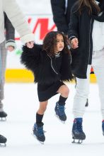 Kourtney Kardashian takes Penelope and North West to ice skating in Central Park, Little North West was seen taking a tumble on the ice several times and also scuffed her knee climbing rocks in Central Park
