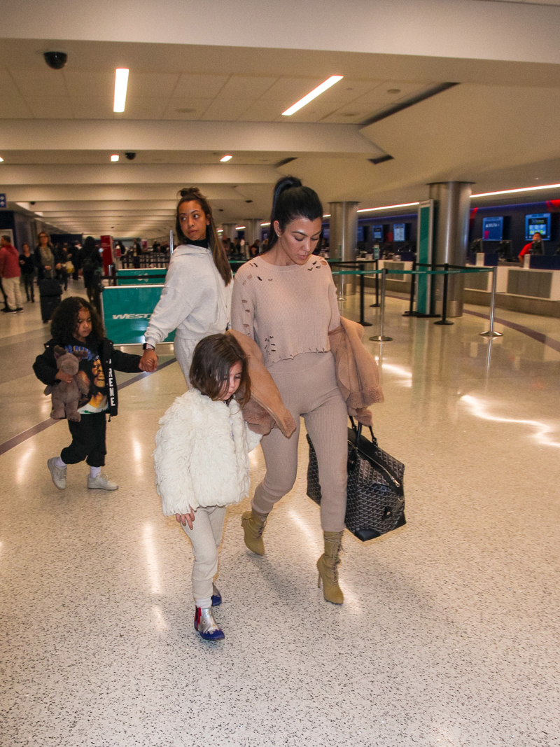 Kourtney Kardashian, daughter Penelope and her niece North West are seen in Los Angeles International Airport in Los Angeles. 