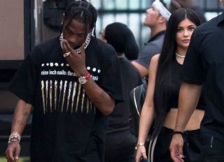 Kylie Jenner and Travis Scott visit DJ Khalid video shoot and go for dinner at Miami Finga Licking fried food restaurant, Miami. The couple where keen to hide from photographers and seemed the help of an armed guard at the fast food stop. It was unclear if Scott was due to film on set but only spent a short time before heading off on the 30 minute drive to a locals strip mall fast food restaurant.