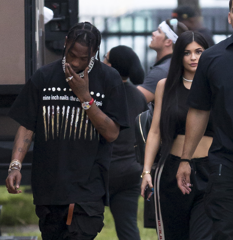 Kylie Jenner and Travis Scott visit DJ Khalid video shoot and go for dinner at Miami Finga Licking fried food restaurant, Miami. The couple where keen to hide from photographers and seemed the help of an armed guard at the fast food stop. It was unclear if Scott was due to film on set but only spent a short time before heading off on the 30 minute drive to a locals strip mall fast food restaurant.
