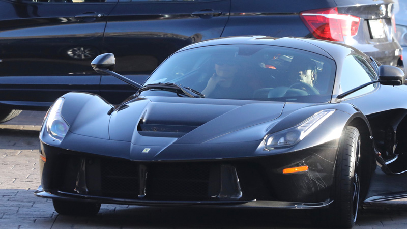 Kylie Jenner and Travis Scott dine with friends at Nobi in Malibu, CA. The new parents left the hotspot with a gang of security in toe as they made their way to their black LaFerrari super car. Recently a LaFerrari was auctioned off for 7.5 million dollars.