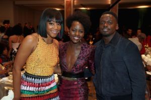 BEVERLY HILLS, CA - MARCH 01: (L-R) Tiffany Haddish, Lupita N'Yongo and Daniel Kaluuya onstage during the 2018 Essence Black Women In Hollywood Oscars Luncheon at Regent Beverly Wilshire Hotel on March 1, 2018 in Beverly Hills, California.