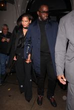 P. Diddy and Cassie walk hand in hand as they leave Craig's Restaurant