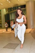 model, Daphne Joy who is 50 Cent's baby mama, showed her enviable curvy figure as she headed out for dinner in Miami wearing a tiny white sports bra, matching white pants and heels.